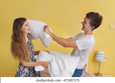 Portrait Of Young Couple Teens , Pillow Fight 