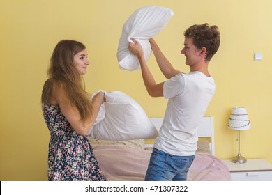 Portrait Of Young Couple Teens , Pillow Fight 