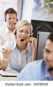 Portrait Of Young Customer Service Operator Talking On Headset, Smiling.?