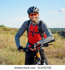 Portrait Of Young Cyclist In Helmet And Glasses. Sport Lifestyle Concept.