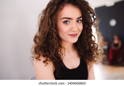 A Portrait Of Young Dance Woman Teacher Indoors Looking At Camera.