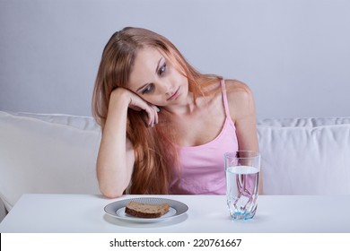 Portrait Of Young Depressed Girl With Eating Disorder