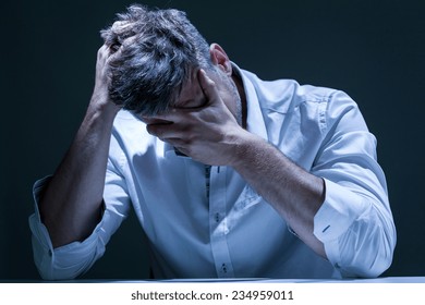 Portrait Of Young, Depressed Man In Pain