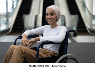 Portrait of young disabled mixed-race female executive in the lobby at office