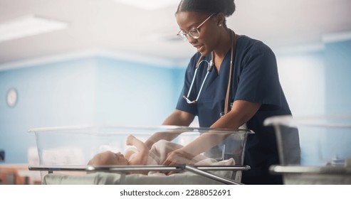 Portrait of a Young Doctor Checking Up and Caring for a Newborn Baby Lying in a Bassinet in a Modern Maternity Ward. Cute Neonate Healthy Child Waiting for Mother to Take the Baby Home - Shutterstock ID 2288052691