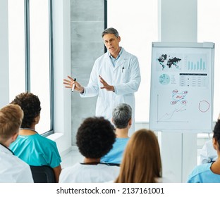 Portrait of a young doctor teaching on a seminar in a board room or during an educational class at convention center  - Shutterstock ID 2137161001