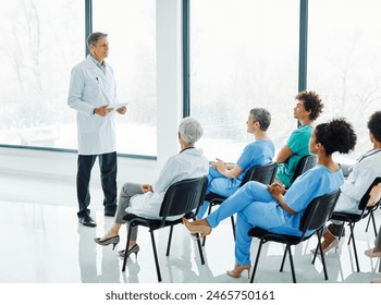 Portrait of a young doctor teaching on a seminar in a board room or during an educational class at convention center 