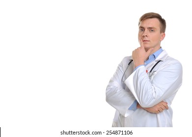  Portrait Of A Young Doctor Thinking Of The Best Decision To Treat A Patient, Etc. Copy Space On The Left Can Be Used For Your Text.