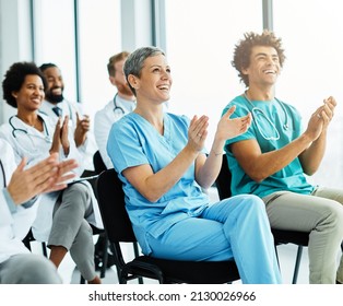 Portrait of a young doctors and nurses in audiance during a seminar in a board room or during an educational class at convention center  - Shutterstock ID 2130026966