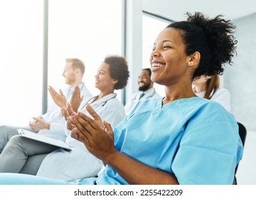 Portrait of a young doctors and nurses in audiance during a seminar in a board room or during an educational class at convention center  - Powered by Shutterstock
