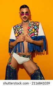 Portrait Of A Young Drag Queen In Colorful Dress On Yellow Background