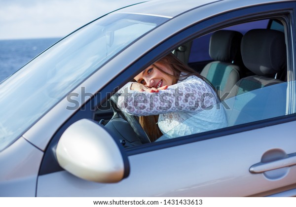 portrait of young driver\
sit at the car