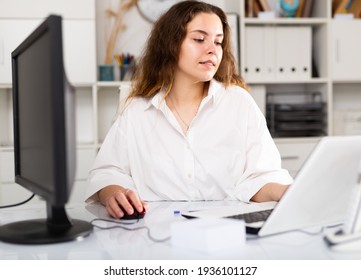 Portrait Of Young Elegant Confident Female Office Worker In A Company At A Modern Workplace