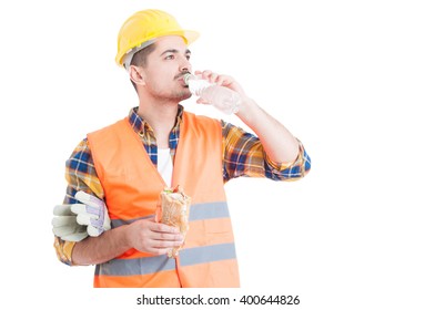 Portrait Of Young Engineer Eating A Sandwich And Drinking Water As Break Snack Concept Isolated On White Background