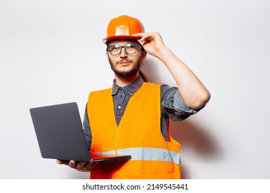 Portrait Of Young Engineer Holding Laptop On White Background, Looking Away.