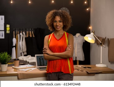 Portrait Of A Young Fashion Designer Working On Her Atelier