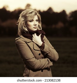 Portrait Of Young Fashion Woman Walking On Nature