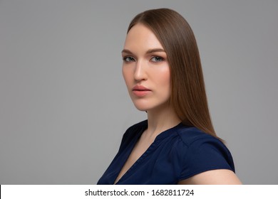 Portrait Of A Young Fashionable Serious Woman Standing Monochromatic Background