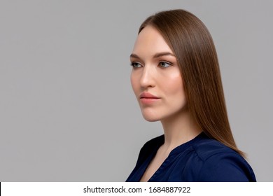 Portrait Of A Young Fashionable Serious Woman Standing Monochromatic Background