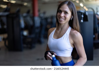 Portrait Of Young Female Athlete Smiling In Gymnasium