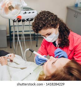 Portrait Of Young Female Dentist In Office. Dentist With Tools. Woman Undergo Dental Check Up. Social Medicine, Budget Dental Clinic In Poor Countries