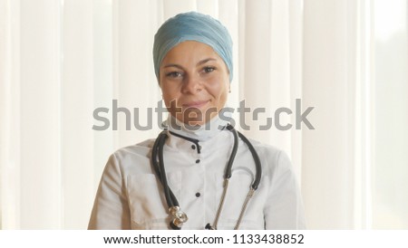 Portrait of a young female doctor in a mask.