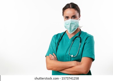 Portrait Of Young Female Doctor In Medical Mask Looking At Camera Isolated On White