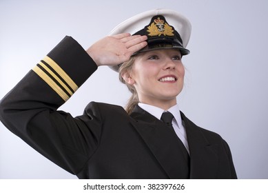 Portrait Of A Young Female Naval Officer Saluting