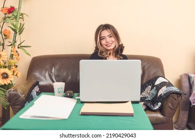 Portrait of a young female online customer service representative before training starts. She is excited to start working. - Shutterstock ID 2190429043