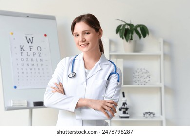 Portrait of young female ophthalmologist in clinic - Powered by Shutterstock