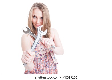 Portrait Of Young Female Plumber Holding Crossed Wrenches With Copyspace Area Isolated On White Background