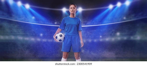  Portrait of young female soccer player with soccer ball standing in a big stadium. - Powered by Shutterstock