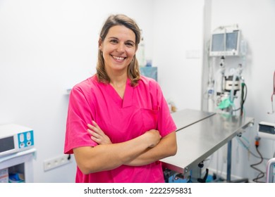 Portrait Of A Young Female Veterinarian At The Vet Clinic, Arms Crossed