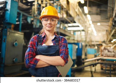 Portrait Of Young Female Worker In The Factory