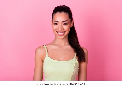 Portrait Of Young Filipino Woman With High Ponytail Wear Beautiful Trendy Singlet Top Isolated On Pink Color Background