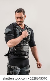 Portrait of young fit athletic man wearing EMS costume