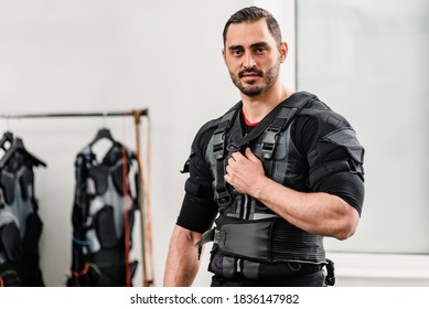 Portrait Of Young Fit Athletic Man Wearing EMS Costume