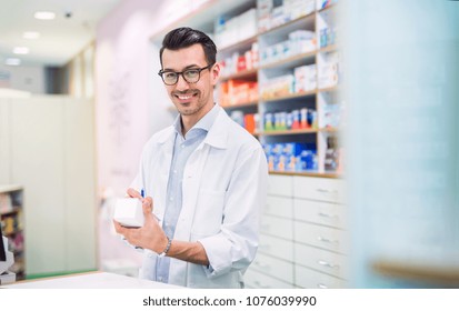 Portrait of a young friendly male pharmacist. - Powered by Shutterstock