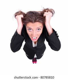 A Portrait Of A Young Frustrated Woman Pulling Out Hair Over White Background