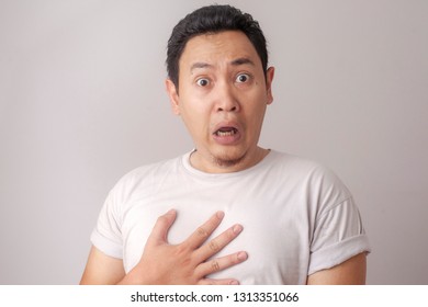 Portrait Of Young Funny Asian Man Shocked Or Surprised Expression With Mouth Open, Worried To See Something Bad Happen