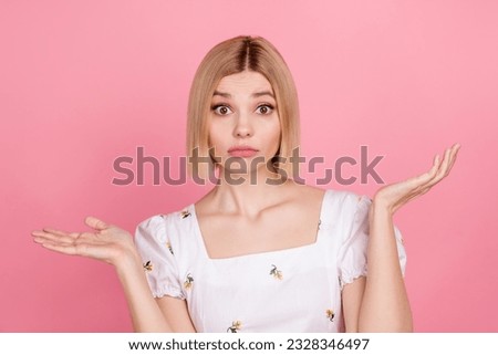 Portrait of young funny girl blonde short hair shrug shoulders dilemma staring you dont know her password isolated on pink color background