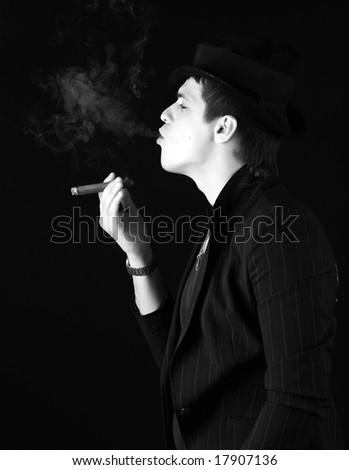 Similar – young guy in a shirt smokes on the street