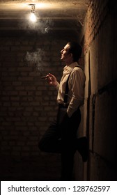 Portrait of young gangster with cigar