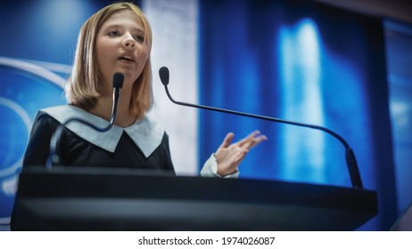 Portrait of an Young Girl Activist Delivering an Emotional and Powerful Speech at a Press Conference in Government Building. Child Speaking to Congress at Summit Meeting with World Leaders. - Powered by Shutterstock