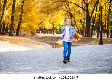 Portrait of a young girl in an autumn park