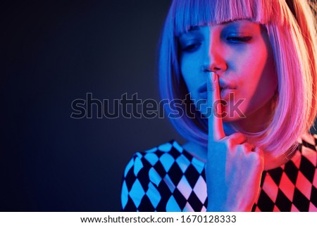 Similar – Young blonde woman asking for silence