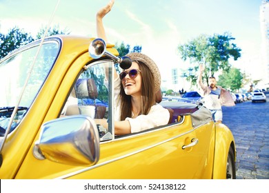 Portrait Of Young Girl Driving Cabriolet At Sunset.