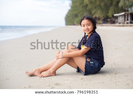 Portrait young girl on the beach