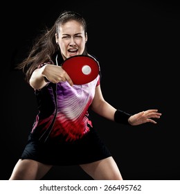 Portrait Of Young Girl Playing Tennis On Black Background 