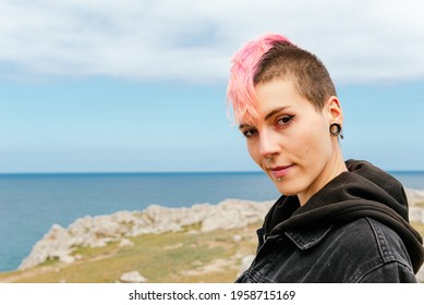 portrait of young girl in punk style. Woman with pink hair and piercings. - Powered by Shutterstock